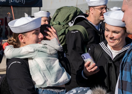 A Sailor reunites with her family following the return of the first-in-class aircraft carrier USS Gerald R. Ford (CVN 78) to Naval Station Norfolk, Nov. 26.