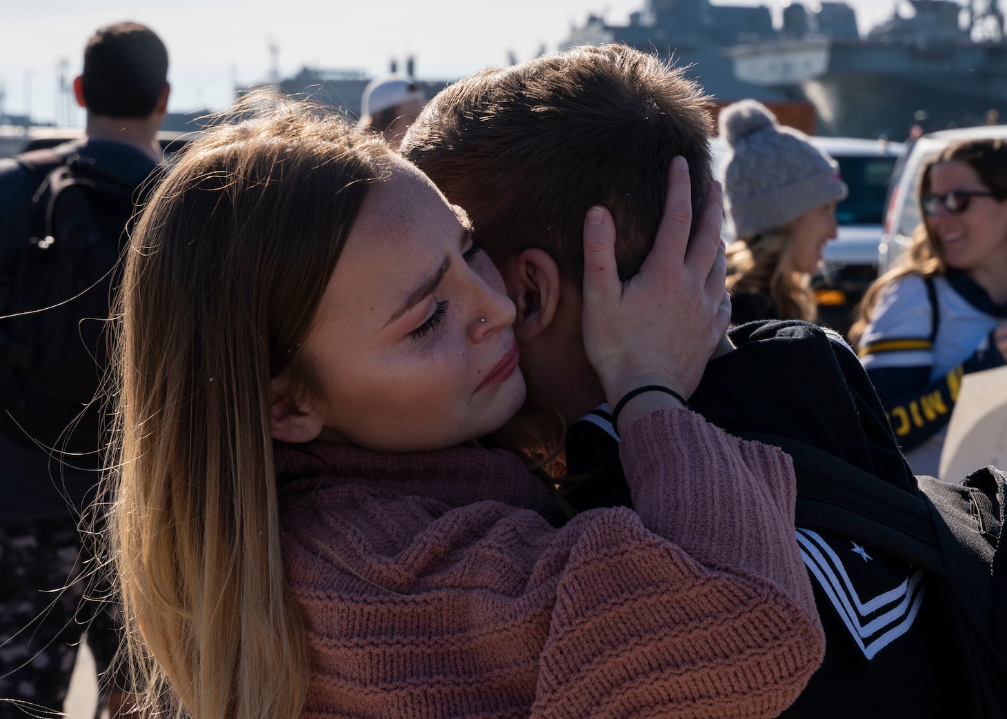 A Sailor reunites with his family following the return of the first-in-class aircraft carrier USS Gerald R. Ford (CVN 78) to Naval Station Norfolk, Nov. 26.
