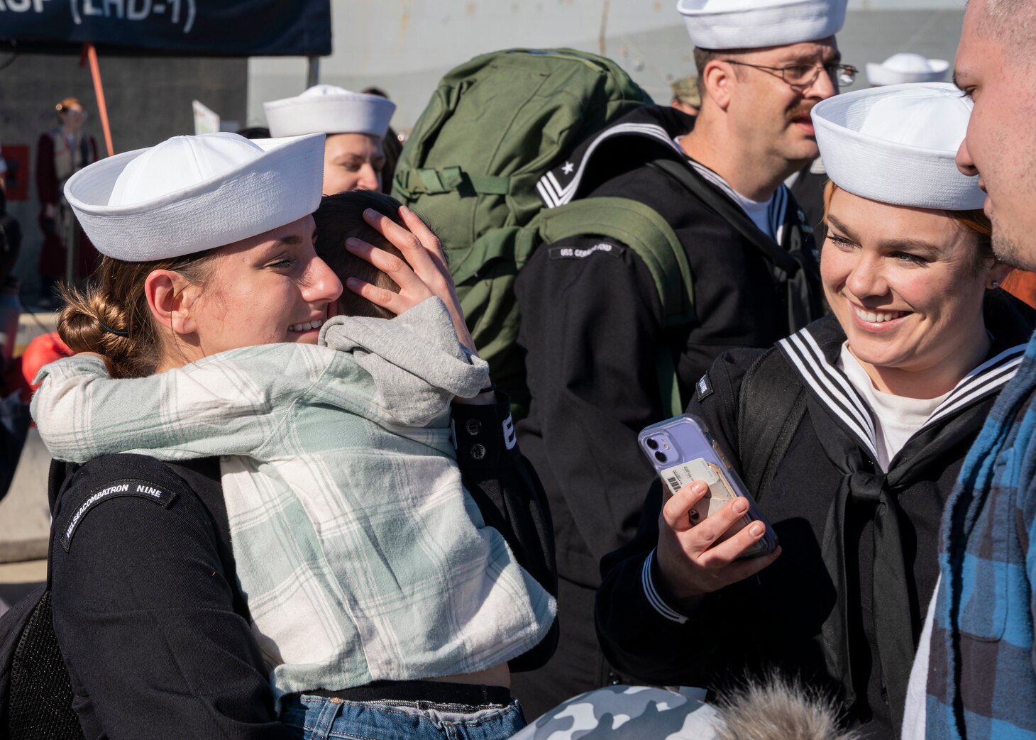 A Sailor reunites with her family following the return of the first-in-class aircraft carrier USS Gerald R. Ford (CVN 78) to Naval Station Norfolk, Nov. 26.