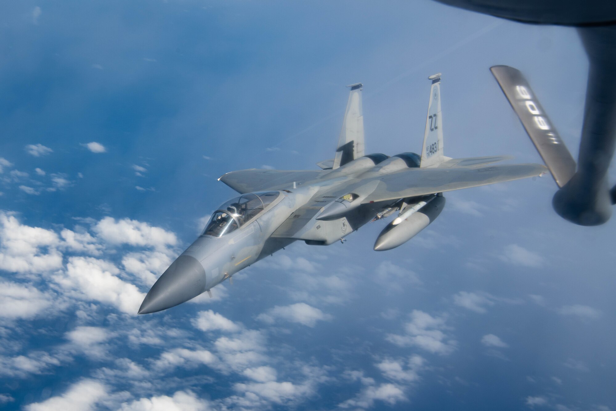 A jet finishes aerial refueling.