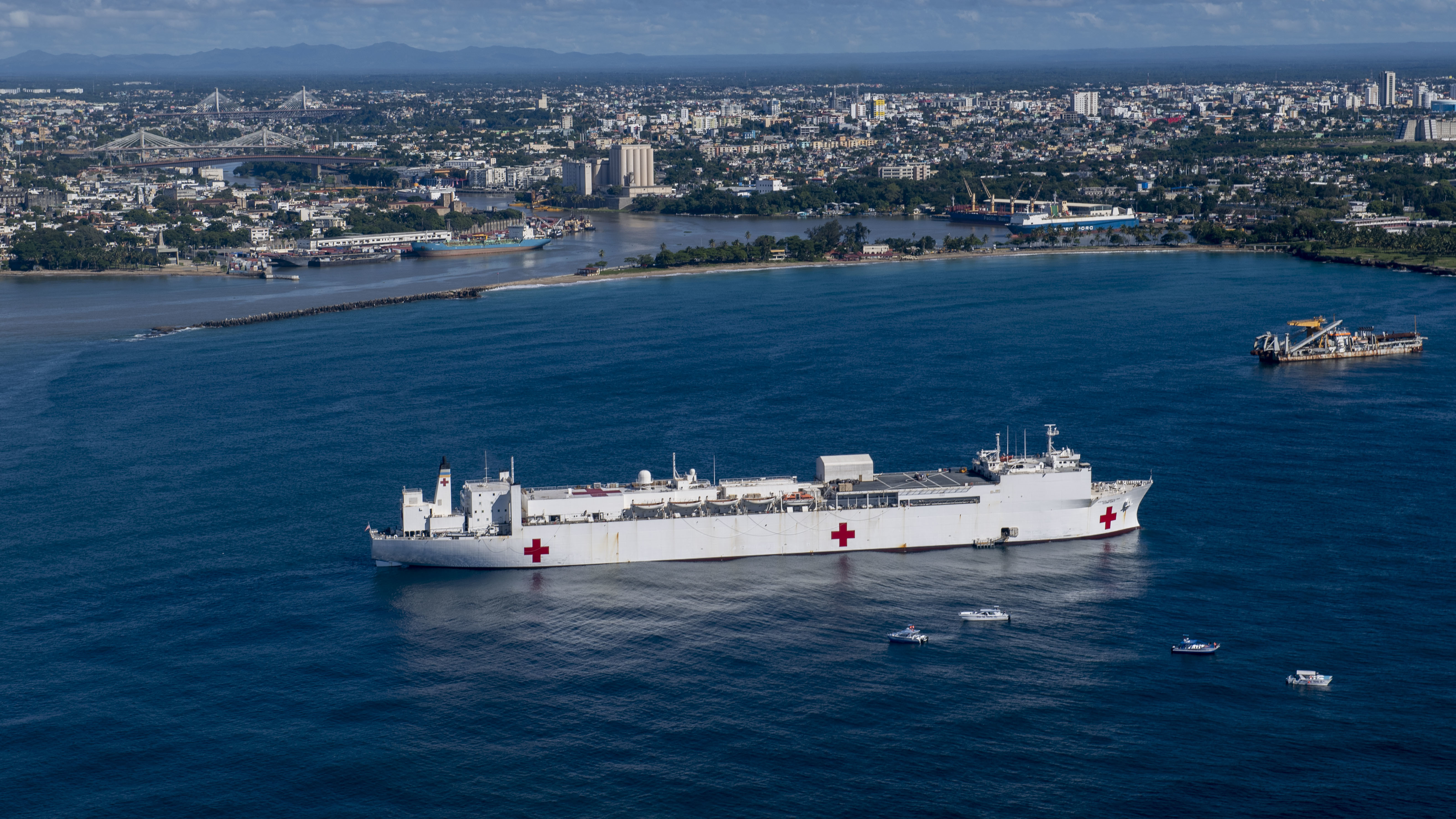 221127-N-DF135-1022 SANTO DOMINGO, Dominican Republic (Nov. 27, 2022) – The hospital ship USNS Comfort (T-AH 20) sits anchored in the harbor of Santo Domingo, Dominican Republic on Nov. 27, 2022. Comfort is deployed to U.S. 4th Fleet in support of Continuing Promise 2022, a humanitarian assistance and goodwill mission conducting direct medical care, expeditionary veterinary care, and subject matter expert exchanges with five partner nations in the Caribbean, Central and South America. (U.S. Navy photo by Mass Communication Specialist 3rd Class Deven Fernandez)