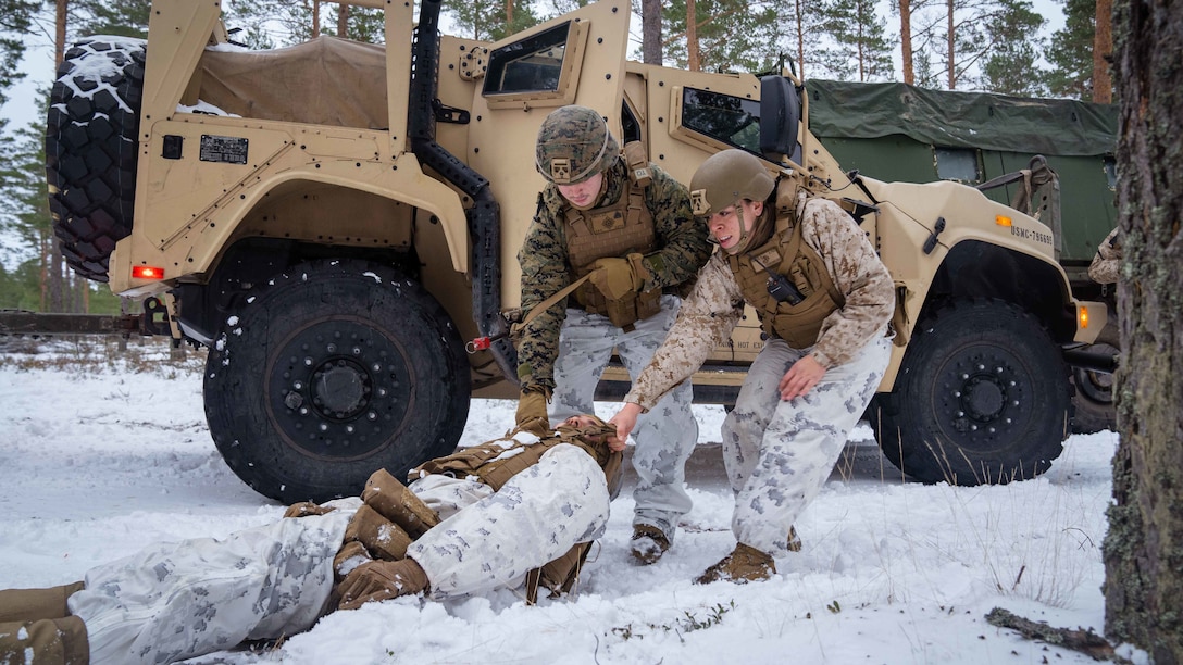 U.S. Marine Corps Sgt. Andrea Blaine, right, and Sgt. Garrison Sibley, both motor vehicle operators with Combat Logistics Battalion 6, drag a simulated wounded Marine to safety during a training exercise in Syndalen, Finland, Nov. 22, 2022.Task Force Red Cloud, headquartered by elements of CLB-6, is deployed to Finland in support of Exercises SYD 2022 and Freezing Winds 2022 to enhance U.S. and Finnish select interdependence in the maritime domain; solidify bilateral maritime maneuver within the Finnish littoral environment; and foster strong relationships between U.S. Marine Corps and Finnish Defense Force sustainment units.