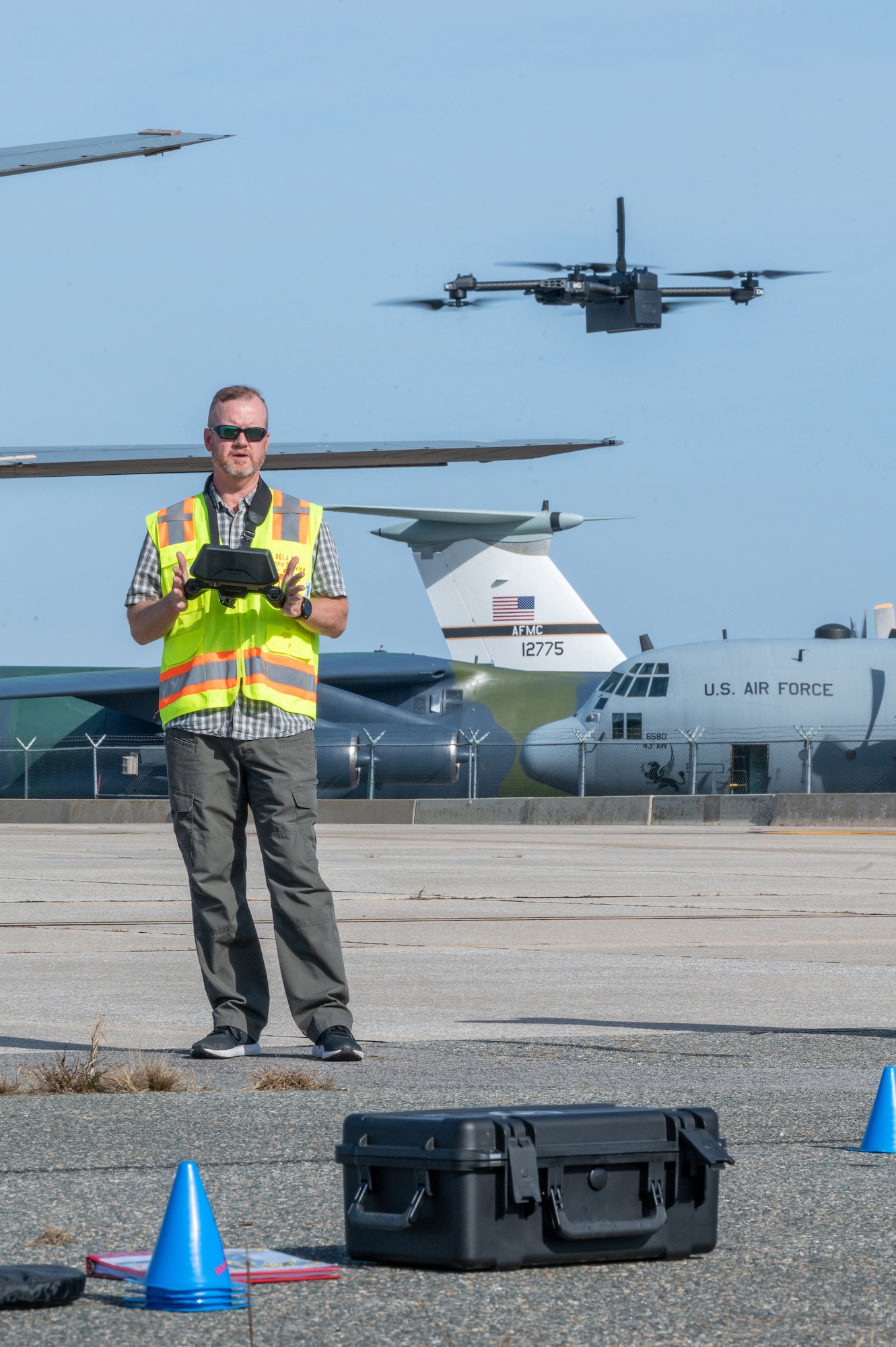 Ken Jones, 436th Mission Generation Group continuous process improvement manager, lands a Skydio X2D drone at Dover Air Force Base, Delaware, Nov. 4, 2022. This flight marked the first drone inspection of the structural integrity of a Dover AFB aircraft. (U.S. Air Force photo by Mauricio Campino)