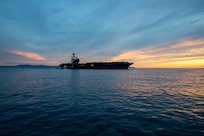 The Nimitz-class aircraft carrier USS George H.W. Bush (CVN 77), along with the embarked staff of Carrier Strike Group (CSG) 10, arrives in Naples, Italy, for a scheduled port visit Nov. 28, 2022.