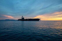 The Nimitz-class aircraft carrier USS George H.W. Bush (CVN 77), along with the embarked staff of Carrier Strike Group (CSG) 10, arrives in Naples, Italy, for a scheduled port visit Nov. 28, 2022.