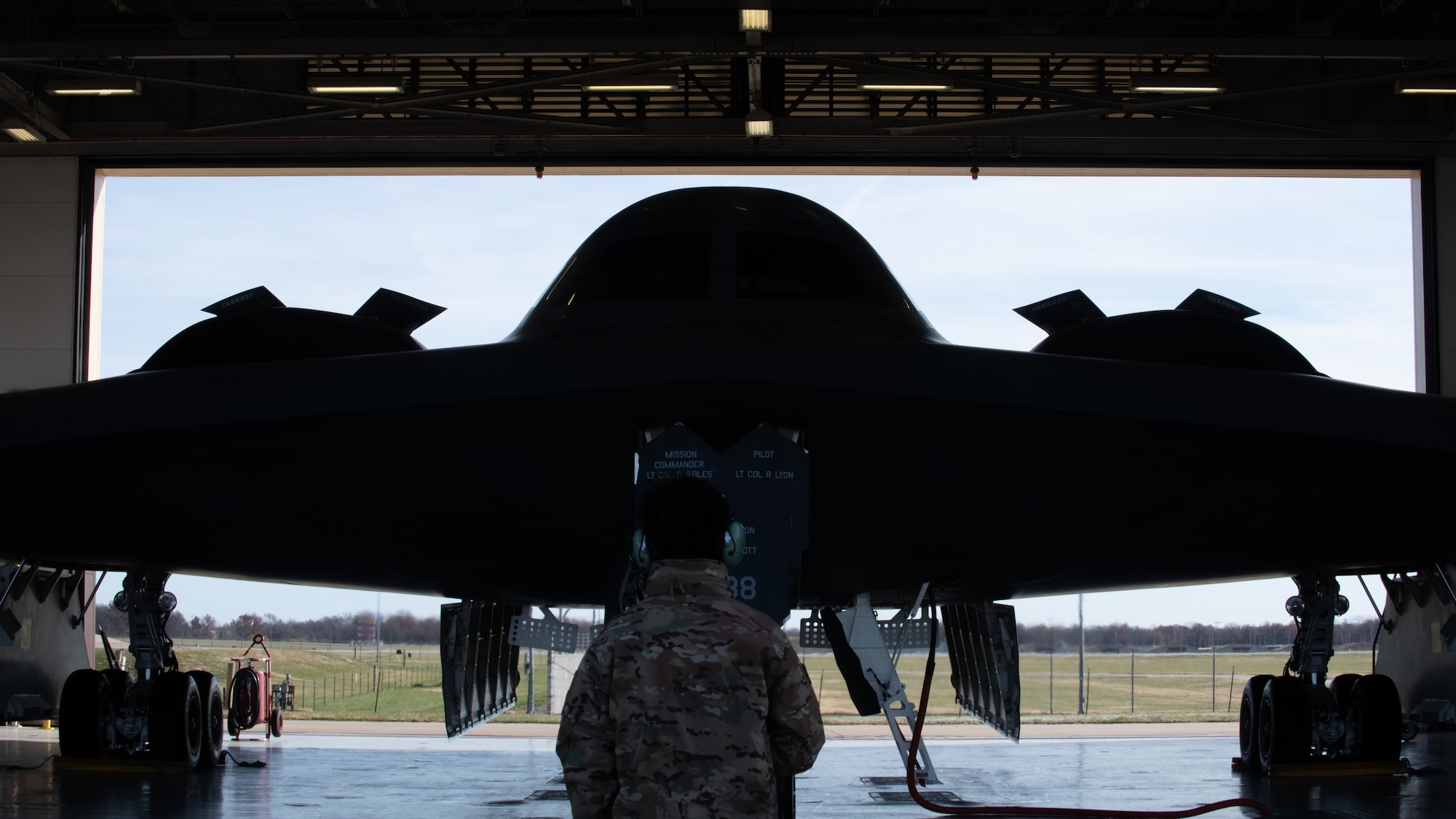 A 509th Bomb Wing maintainer prepares a B-2 Spirit stealth bomber for takeoff at Whiteman Air Force Base, Missouri, Nov. 7, 2022. Maintainers at Whiteman AFB perform exercises to keep the B-2 ready to fly anytime, anywhere. (U.S. Air National Guard photo by Airman 1st Class Phoenix Lietch)