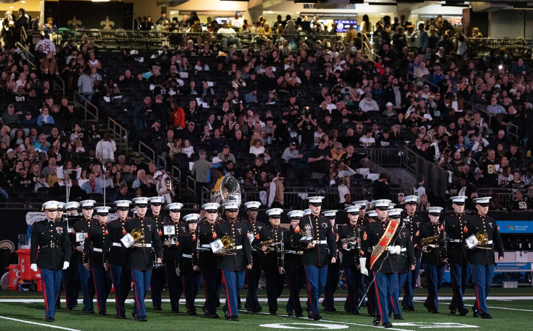U.S. Marines assigned to the Marine Forces Reserve Band perform the Armed Forces Medley during halftime of a New Orleans Saints football game at the Caesars Superdome, New Orleans, Nov. 20, 2022. The Armed Forces Medley is a collection of the official songs of each of the United States Armed Services. (U.S. Marine Corps Photo by Staff Sgt. Jestin Costa)