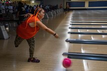 A Special Olympics athlete bowls during the Special Olympics Hawaii 2022 Holiday Classic event aboard MCBH, Nov. 19-20, 2022. Special Olympics Hawaii is an organization that provides year-round sports training and competition for children and adults with intellectual disabilities. The Holiday Class is an annual event hosted by MCBH to foster relations between the local and military communities. (U.S. Marine Corps photo by Cpl. Israel Ballaro).