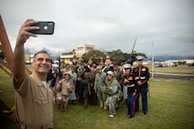 U.S. Marine Corps Col. Speros Koumparakis takes a CO selfie with Marines and Sailors participating in the annual Marine Corps birthday pageant on Marine Corps Base Hawaii, Nov. 10, 2022. The birthday pageant celebrates the 247th birthday of the Marine Corps and pays homage to the rich legacy of the Corps. (U.S. Marine Corps photo by Lance Cpl. Cody Purcell)