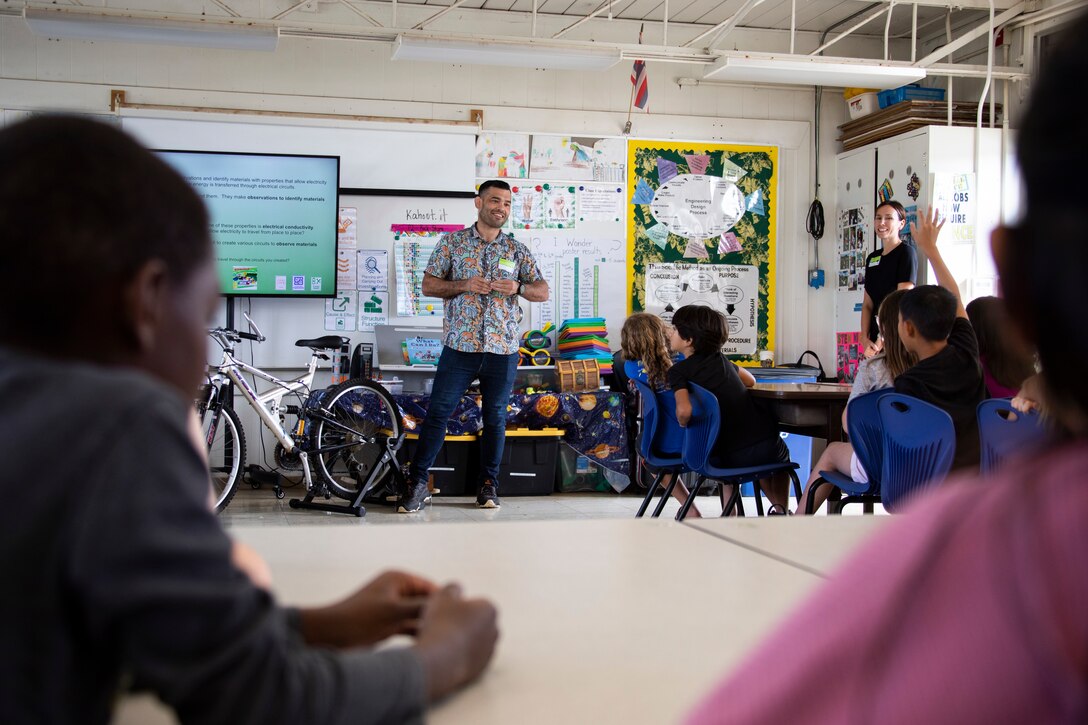 Masaki Shinzato, energy communications consultant, Energy-Utility Branch at Marine Corps Base Hawaii, speaks to students during an energy presentation at Mokapu Elementary School, MCBH, Nov. 10, 2022. The purpose of the presentation was to inform students on where energy comes from, energy conservation and the importance of protecting resources. (U.S. Marine Corps photo by Cpl. Samantha Sanchez)
