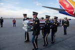 Members of the Minnesota National Guard funeral honors team carry the casket of U.S. Army Staff Sgt. Donald Duchene, a World War II service member killed in action in 1943, during a planeside honors ceremony Sept. 30, 2022. Since its inception in 2006, the Minnesota Military Funeral Honors team has conducted more than 55,000 funerals for veterans of all branches.