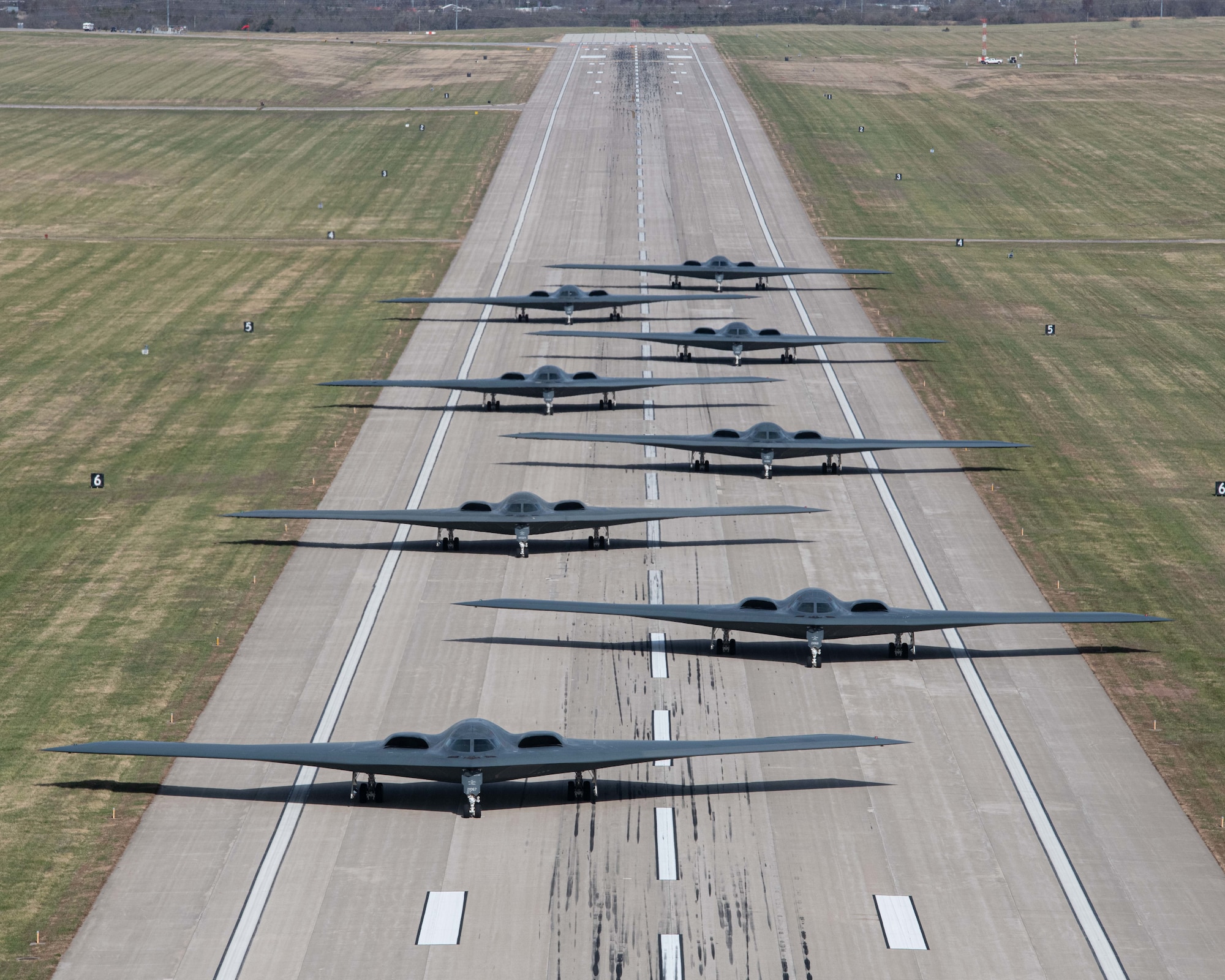 B-2 Spirit stealth bombers assigned to Whiteman Air Force Base taxi and take-off during exercise Spirit Vigilance on Whiteman Air Force Base, Missouri November 7, 2022. Routine exercises like Spirit Vigilance assure our allies and partners that Whiteman Air Force Base is ready to execute nuclear operations and global strike anytime, anywhere. (U.S. Air Force photo by Airman 1st Class Bryson Britt)