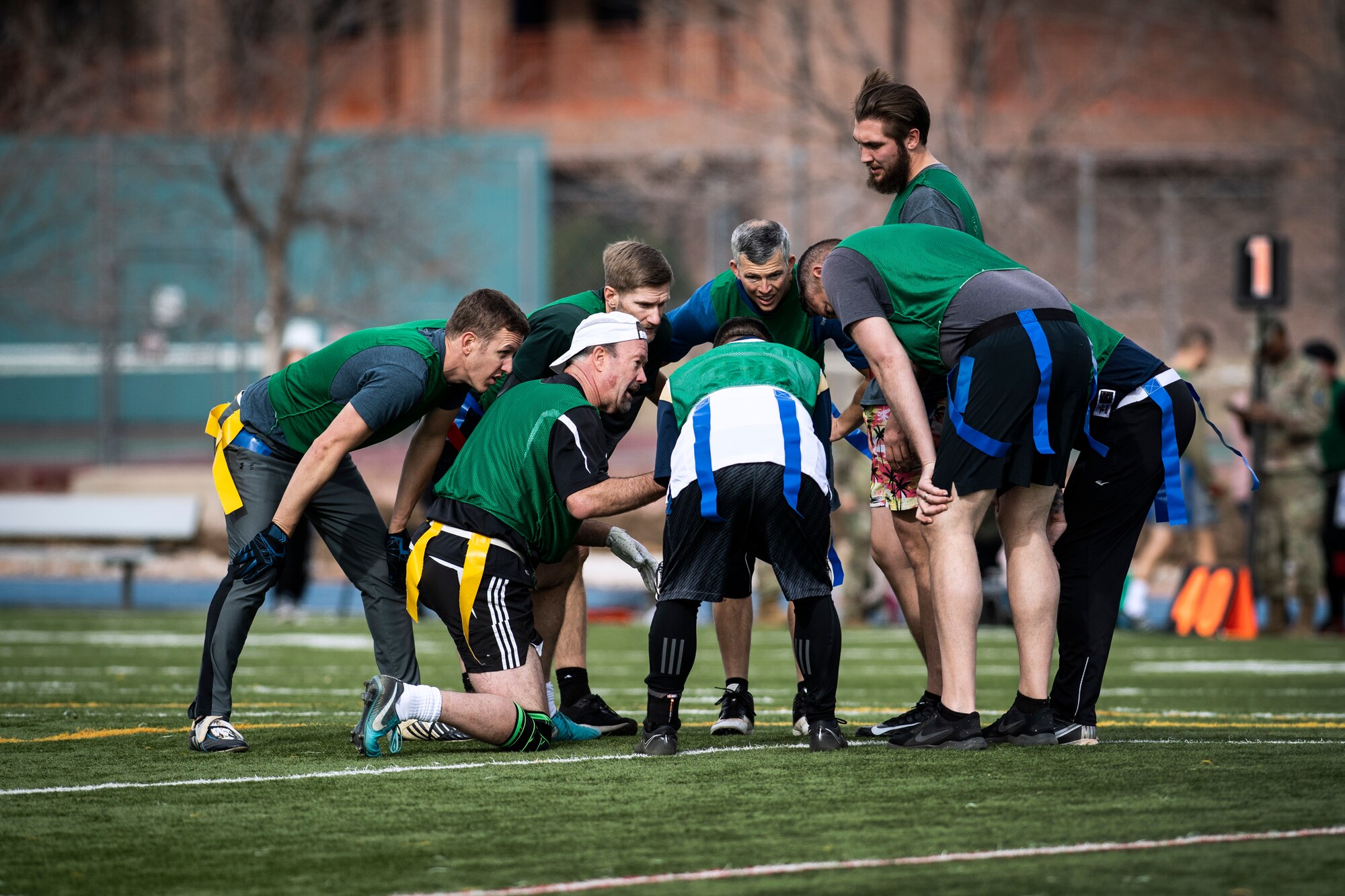 Flag football team huddles up