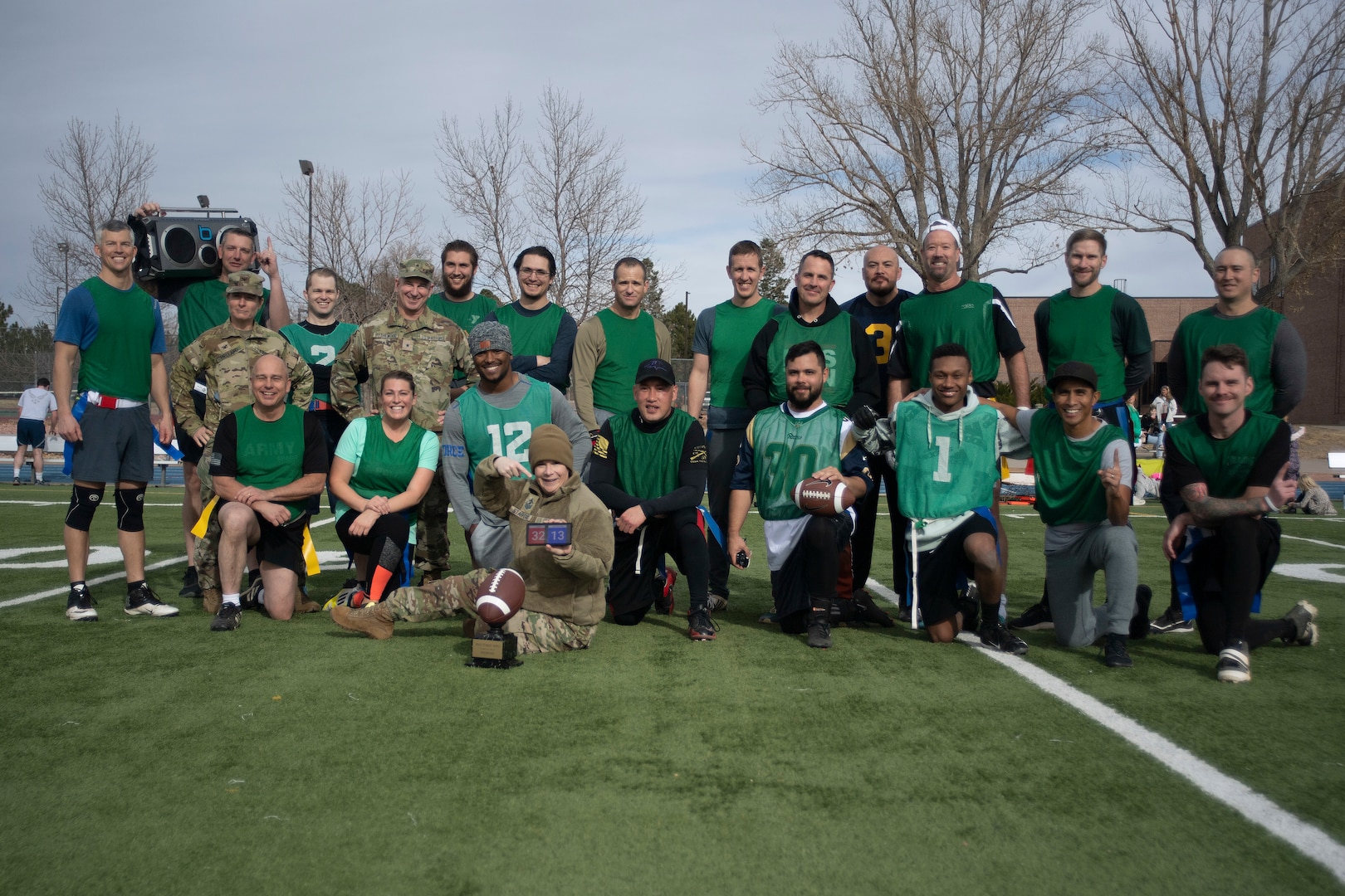 Flag football team members pose for a group photo