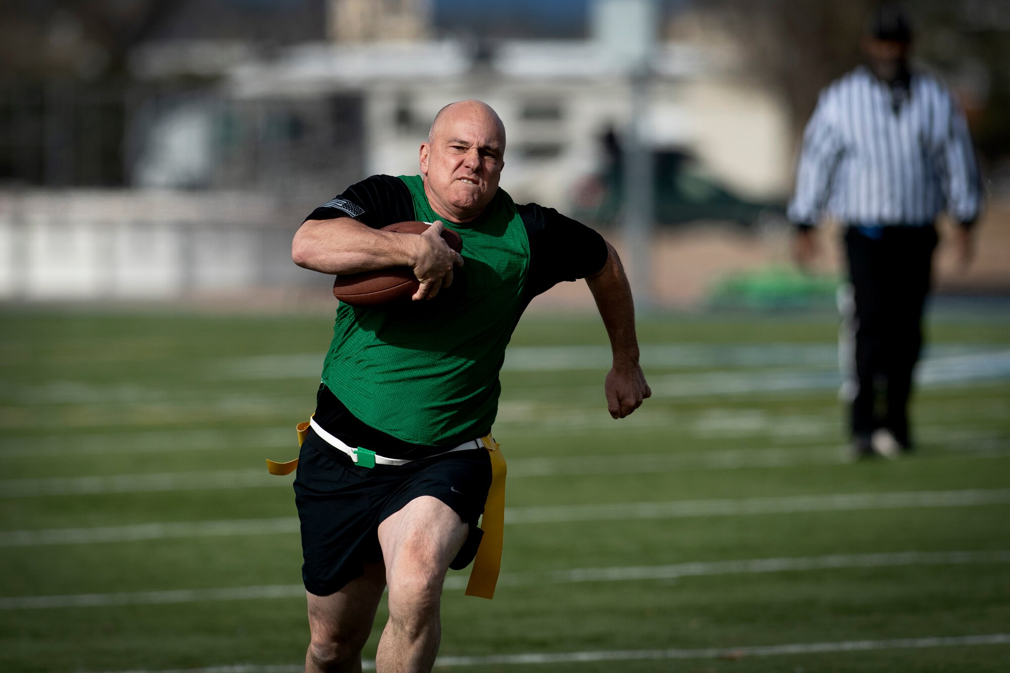 Man running while carrying football