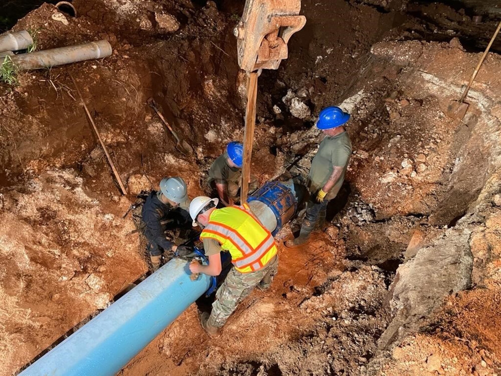 Members from 36th Civil Engineer Squadron access damage to one of Andersen Air Force Base’s main water supply lines near Andersen AFB, Guam, October 20, 2022. The water line was damaged when a contractor was finishing an electrical job off-base and cracked the line, splitting the unground water pipe and causing a major water supply concern for the installation. In order to see the full scope of the project ahead, members from 36th CES dug down to expose the damaged line. (Courtesy photo)