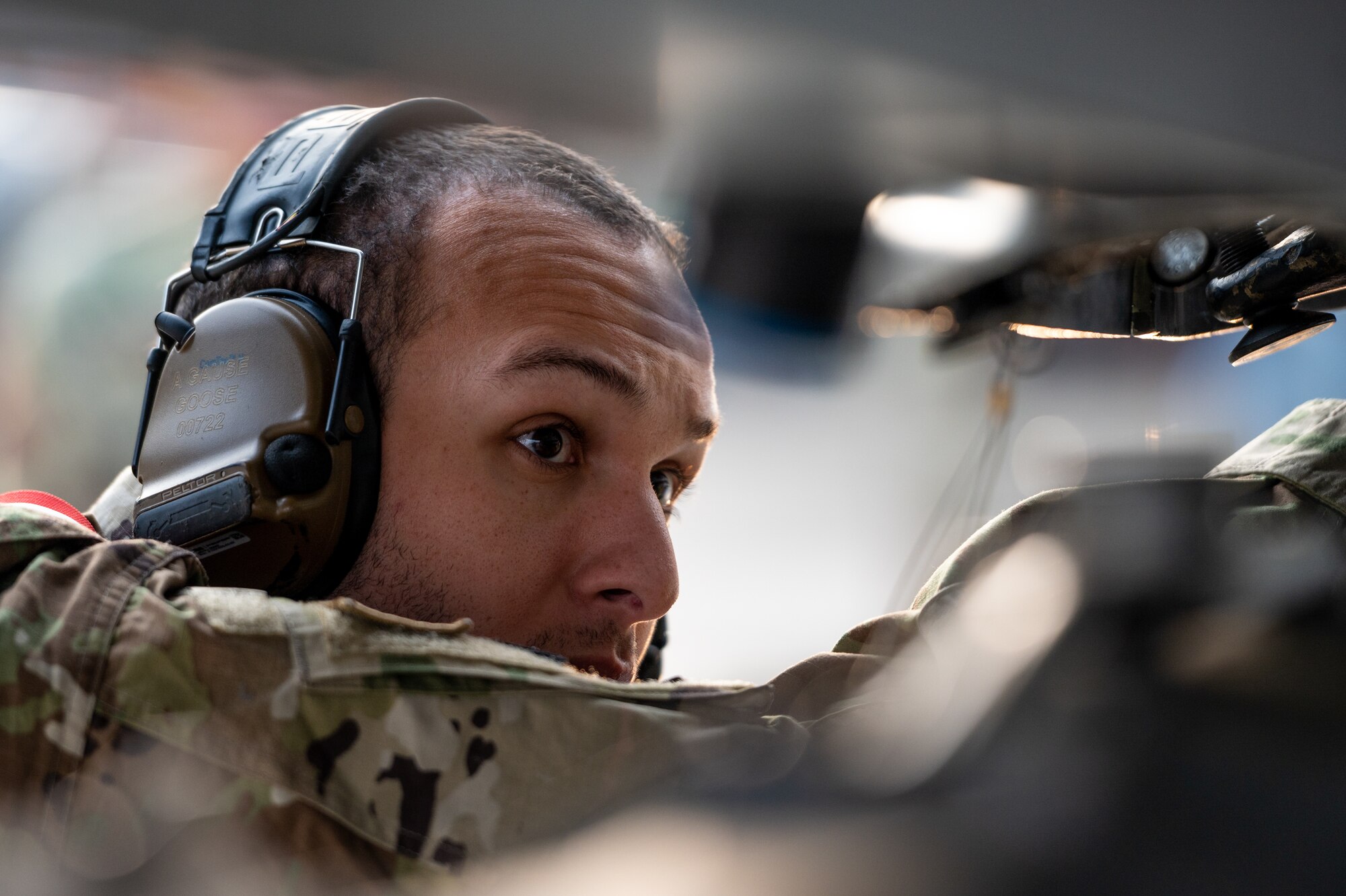 U.S. Air Force Staff Sgt. Anthony Gause, 36th Fighter Generation Squadron weapons load crew team leader, loads a CBU-103 munition onto an F-16 Fighting Falcon during a weapons load crew of the quarter competition