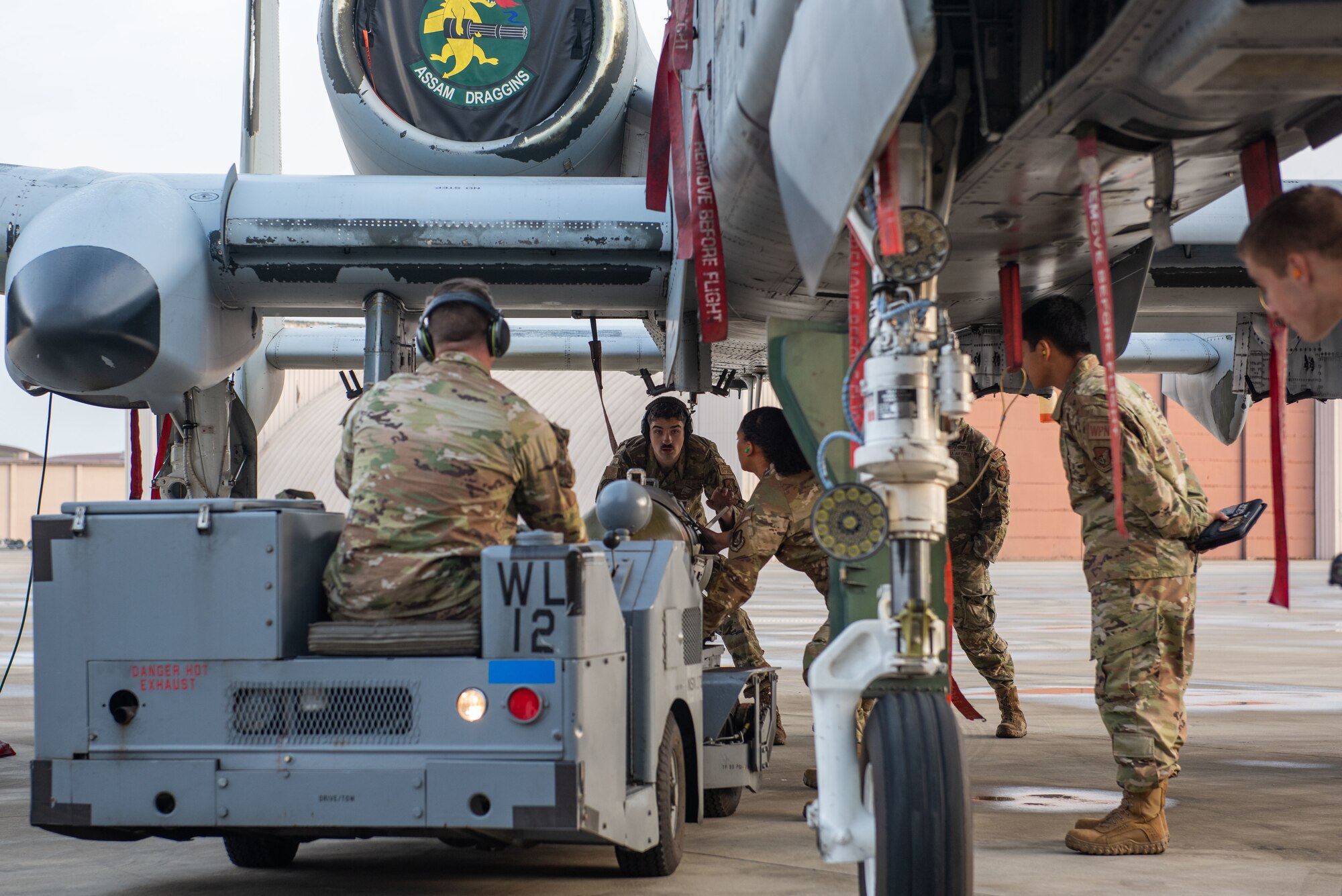 Weapons load crew members from the 25th Fighter Generation Squadron prepare a GBU-31V3 munition to be loaded onto an A-10C Thunderbolt II during a weapons load crew of the quarter competition