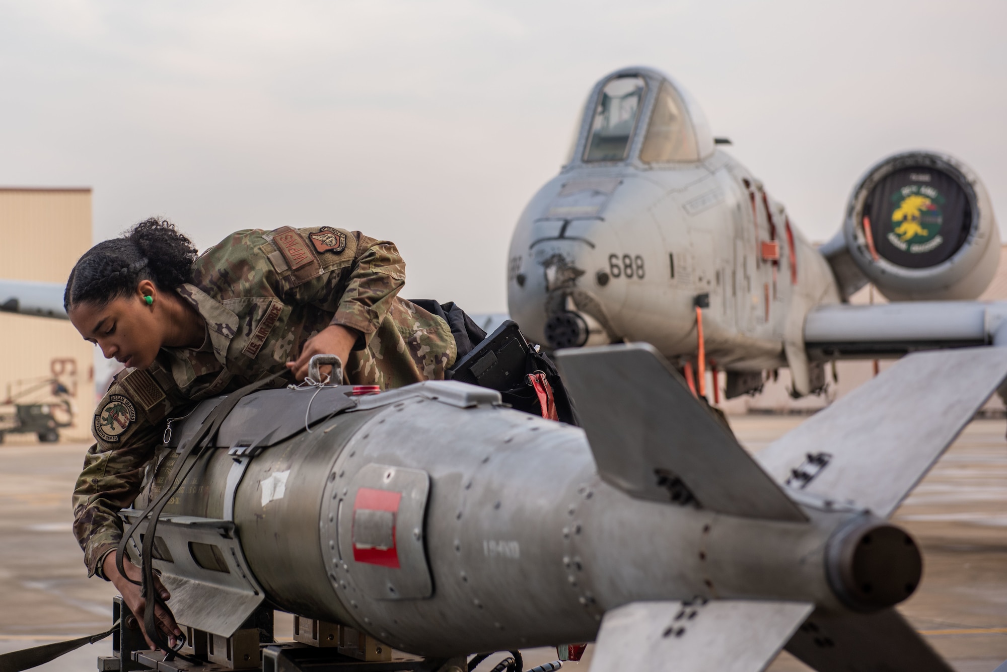 U.S. Air Force Staff Sgt. Kenyah Smith, 25th Fighter Generation Squadron weapons load crew member, prepares a GBU-31V3 munition to load onto an A-10C Thunderbolt II during the Load Crew of the Quarter competition
