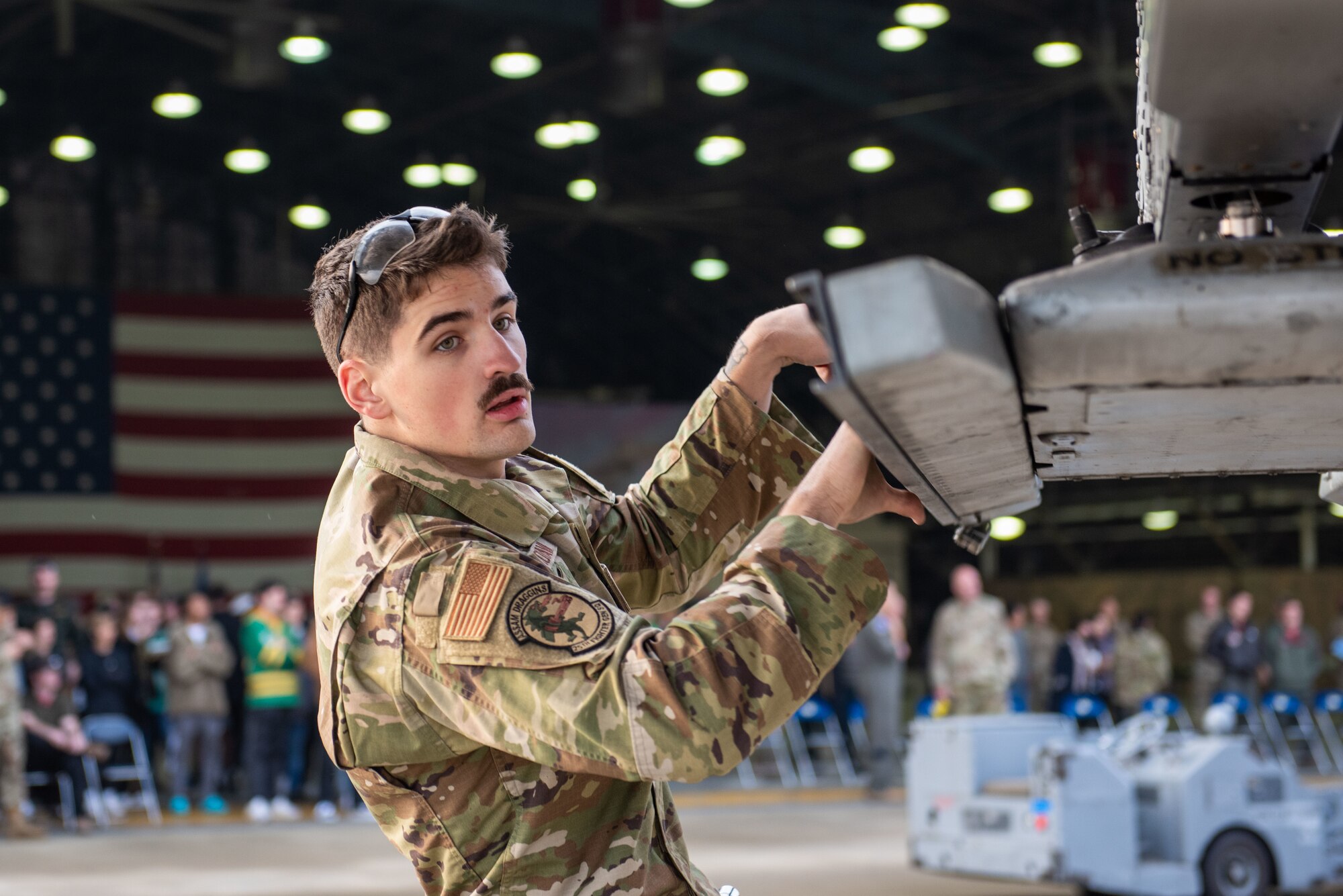 U.S. Air Force Airman 1st Class Mathew Morava, 25th Fighter Generation Squadron weapons load crew member, participates in a weapons load crew of the quarter competition