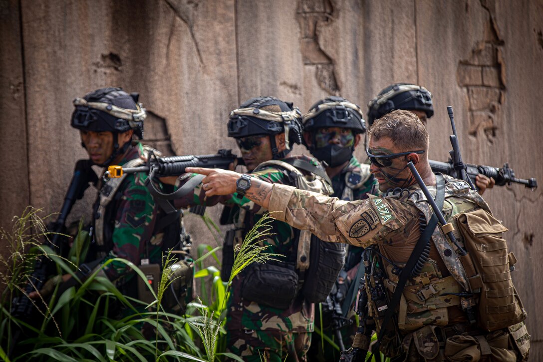 Senior Operations Advisor Staff Sgt. Jeremy Mireles, 5th SFAB Maneuver Advisor Team 5211, suggests a ground maneuver for Tentara Nasional Indonesia Angkatan Darat Soldiers during JPMRC 23-01 at Schofield Barracks, Hawaii, Nov. 2, 2022



JPMRC 23-01 is an immersive training event spanning multiple islands in Hawaii and assessing the readiness of elements of 25th Infantry Division and Allies and Partners. The rotation allows these elements to assess readiness in Hawaii instead of the National Training Center in California or the Joint Readiness Training Center in Louisiana, saving thousands of dollars in defense funding while maintaining a realistic Pacific-focused training environment.