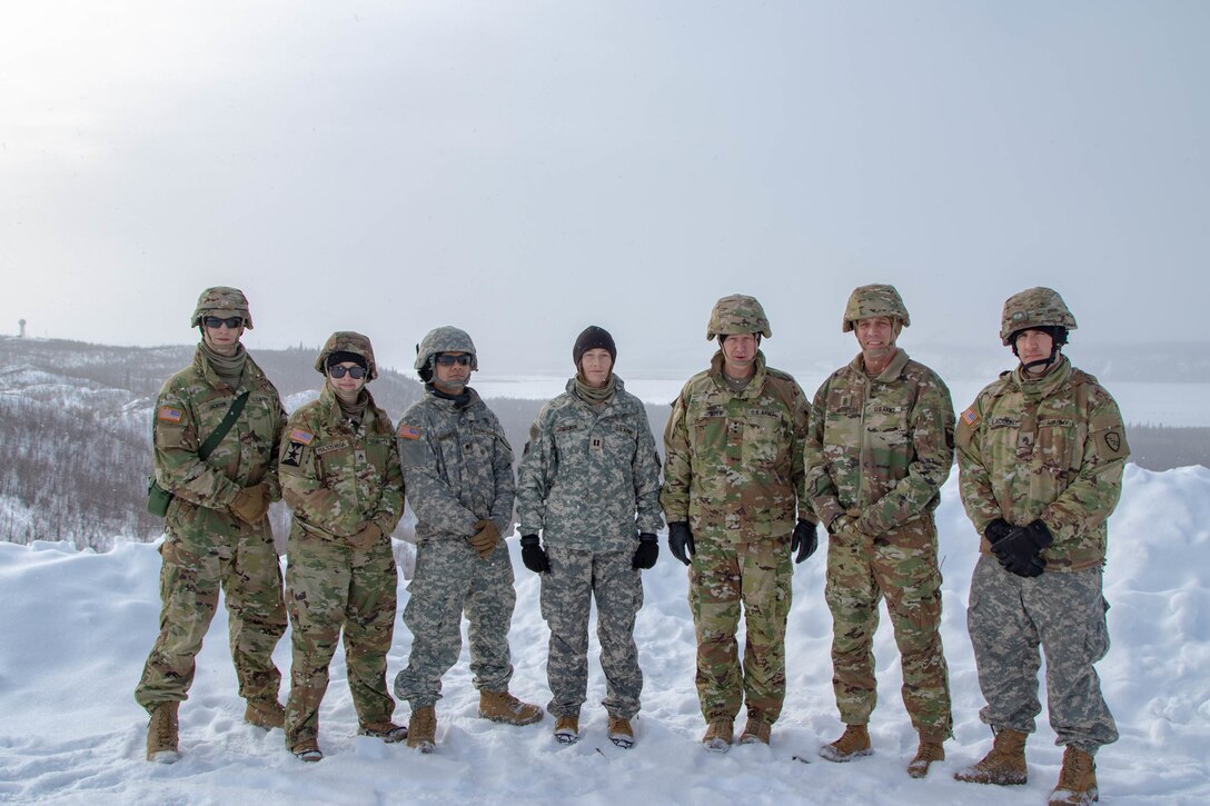 Lt. Gen. Jon A. Jensen, third from right,  Director, US Army National Guard and Command Sgt. Maj. John T. Raines, second from right, Command Sgt. Maj. Of the US Army National Guard poses with members of the 134th Public Affairs Detachment of the Alaska National Guard while visiting the Intermediate Staging Base located near Fort Greely, AK during Joint Pacific Multinational Readiness Center 22-02, on March 20th, 2022. (Photo by Staff Sgt. Christopher B. Dennis/USARAK PAO NCO)