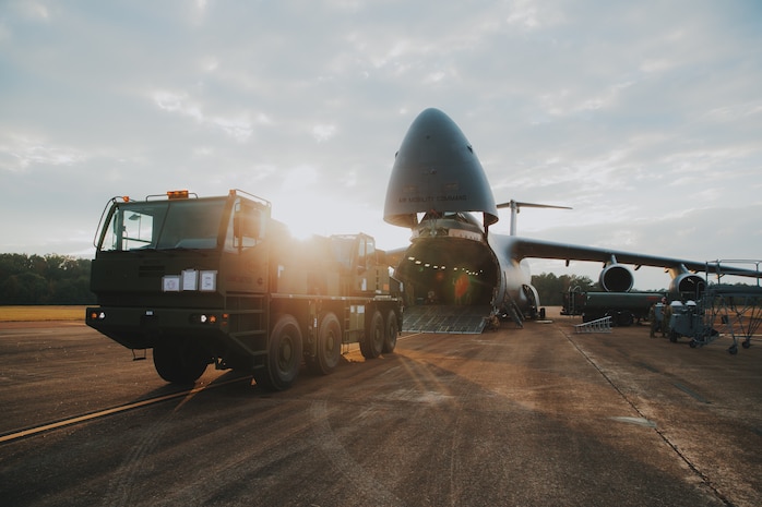 U.S. Marines with 1st Landing Support Battalion, 1st Marine Logistics Group, I Marine Expeditionary Force work with Airmen from the 22nd Airlift Squadron, 60th Operations Group, 60th Air Mobility Wing to on-load a MAC 50 all-terrain crane onto a C5-M Super Galaxy at Columbus Air Force Base, Mississippi, Oct. 30, 2022. Marine Corps Systems Command has been modernizing the legacy cranes as part of a Service Life Extension Program, which includes upgraded controls and overhauled engines. (U.S. Marine Corps photo by Chief Warrant Officer 2 Eric LaClair)