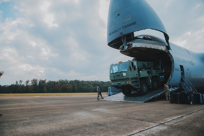 U.S. Marines with 1st Landing Support Battalion, 1st Marine Logistics Group, I Marine Expeditionary Force work with Airmen from the 22nd Airlift Squadron, 60th Operations Group, 60th Air Mobility Wing to offload a Mac 50 all-terrain crane from a C5-M Super Galaxy at Columbus Air Force Base, Mississippi, Oct. 30, 2022. Marine Corps Systems Command has been modernizing the legacy cranes as part of a Service Life Extension Program, which includes upgraded controls and overhauled engines. (U.S. Marine Corps photo by Chief Warrant Officer 2 Eric LaClair)