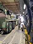 U.S. Marines with 1st Landing Support Battalion, 1st Marine Logistics Group, I Marine Expeditionary Force work with Airmen from the 22nd Airlift Squadron, 60th Operations Group, 60th Air Mobility Wing to on-load a MAC 50 all-terrain crane onto a C5-M Super Galaxy at Columbus Air Force Base, Mississippi, Oct. 30, 2022. Marine Corps Systems Command has been modernizing the legacy cranes as part of the Service Life Extension Program, which includes upgraded controls and overhauled engines. (U.S. Marine Corps photo by MSgt Delsean Barrow)