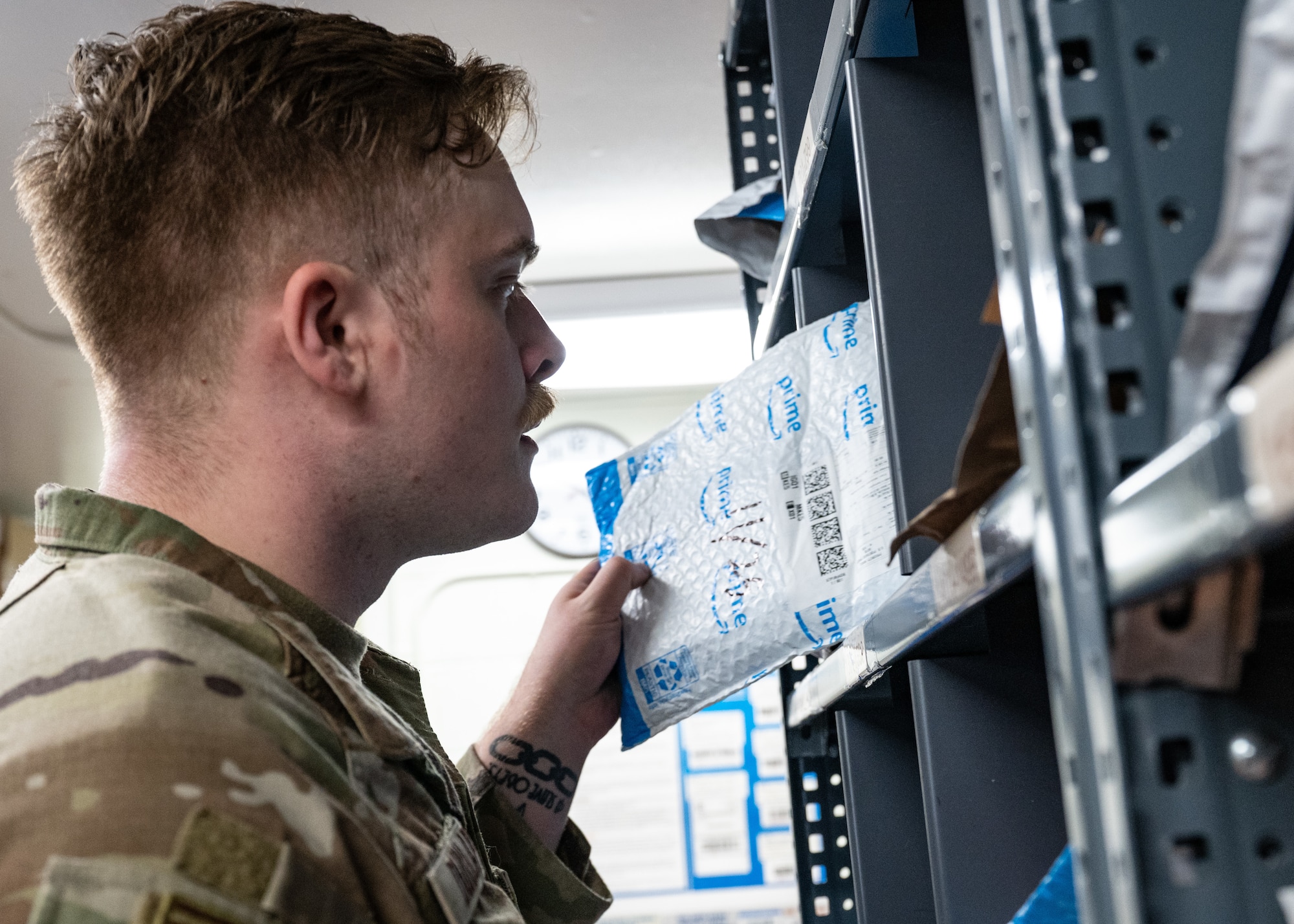 Staff Sgt. Devin Dunlap, 8th Force Support Squadron registered mail NCO in charge, checks a package at Kunsan Air Base, Republic of Korea, Nov. 26, 2022. During their normal operations tempo, the post office receives around 60 – 70 parcels a week. (U.S. Air Force photo by Staff Sgt. Sadie Colbert)