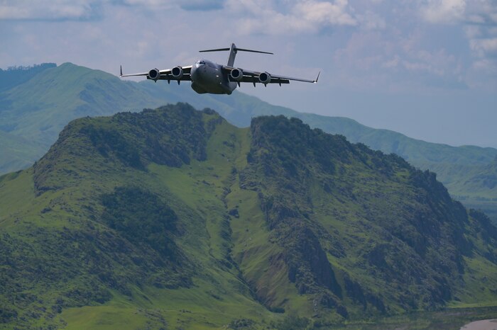A Royal Australian Air Force C-17 Globemaster III flies in a 2-ship formation with a U.S. Air Force C-17 during Exercise Global Dexterity in the skies over Papua New Guinea, Nov. 18, 2022. Exercise Global Dexterity 2022 is being conducted at RAAF Base Amberley, and is designed to help develop the bilateral tactical airlift and airdrop capabilities of the USAF and the RAAF. Both the United States and Australia rely on the C-17A to provide strategic and tactical airlift across the Indo-Pacific region with its ability to provide short-notice and time-critical airlift support, making it essential during humanitarian assistance and disaster relief operations. (U.S. Air Force photo by Staff Sgt. Alan Ricker)