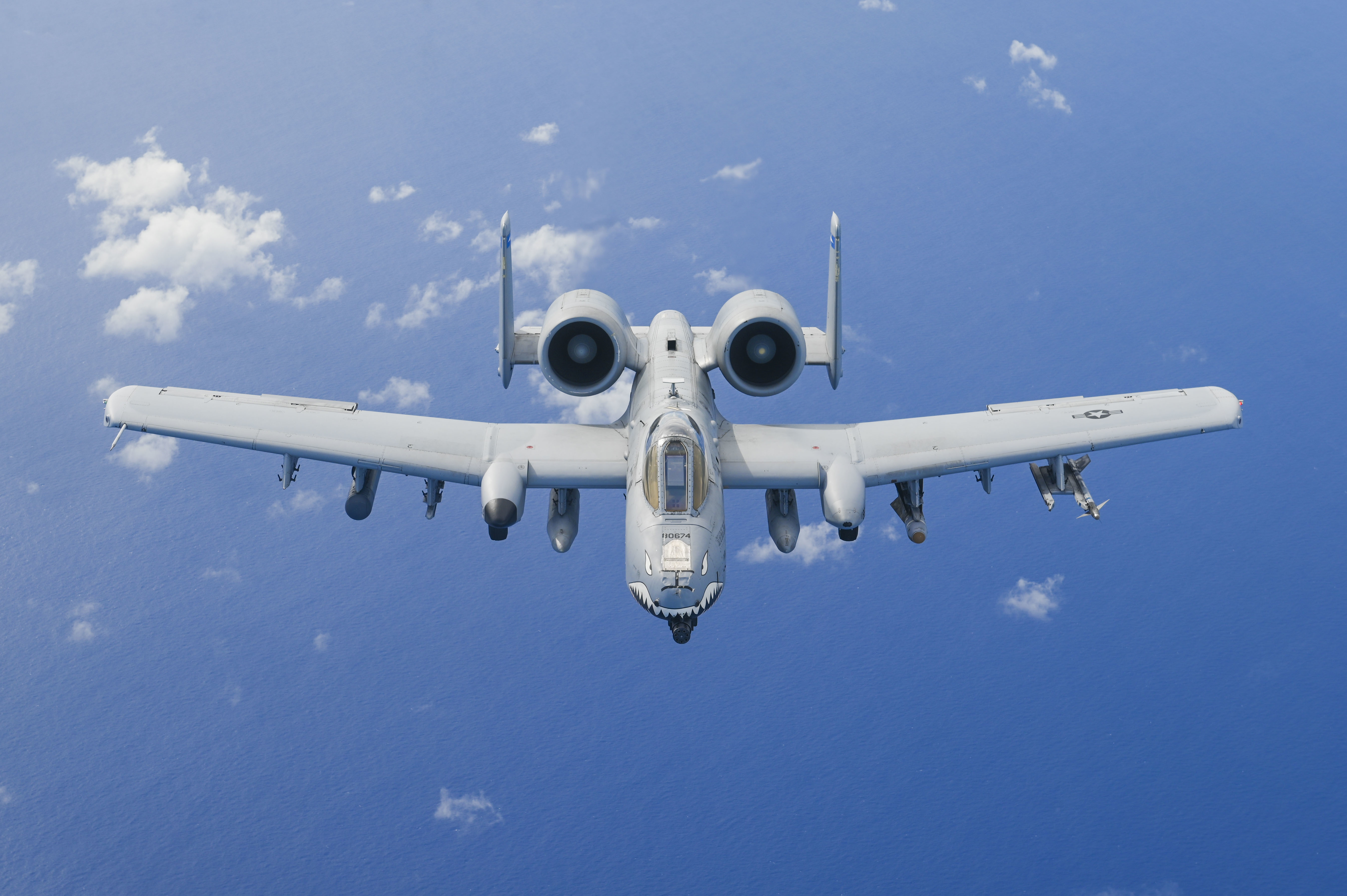 506 EARS aerial refuels Moody A10C Thunderbolt II over Pacific Ocean