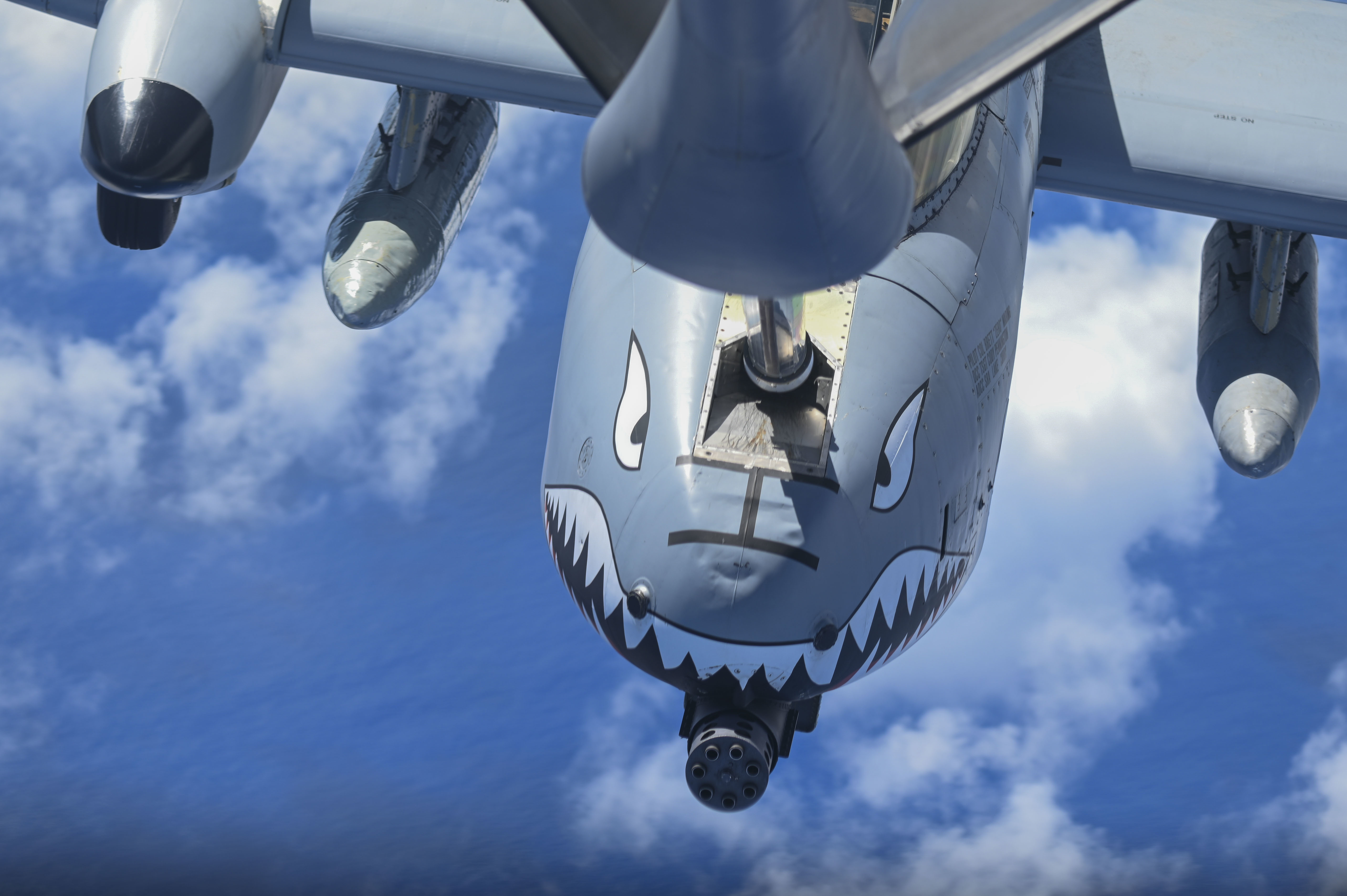 506 EARS aerial refuels Moody A10C Thunderbolt II over Pacific Ocean