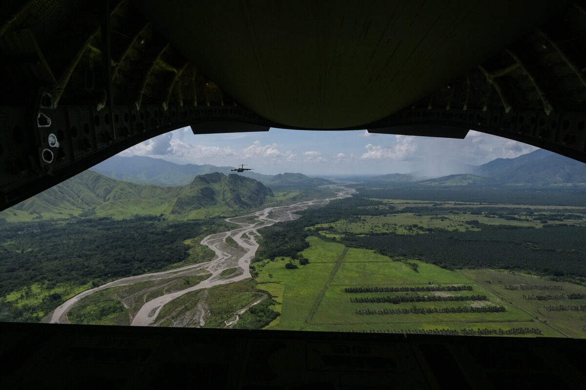 A Royal Australian Air Force C-17 Globemaster III flies in a 2-ship formation with a U.S. Air Force C-17 during Exercise Global Dexterity in the skies over Papua New Guinea, Nov. 18, 2022. Exercise Global Dexterity 2022 is being conducted at RAAF Base Amberley, and is designed to help develop the bilateral tactical airlift and airdrop capabilities of the USAF and the RAAF. Both the United States and Australia rely on the C-17A to provide strategic and tactical airlift across the Indo-Pacific region with its ability to provide short-notice and time-critical airlift support, making it essential during humanitarian assistance and disaster relief operations. (U.S. Air Force photo by Staff Sgt. Alan Ricker)