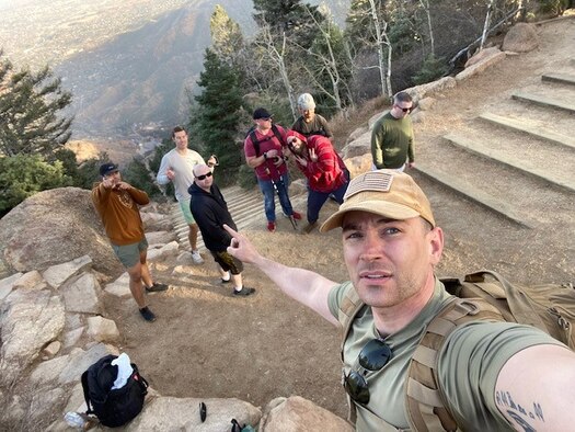 people posing at top of Manitou Incline
