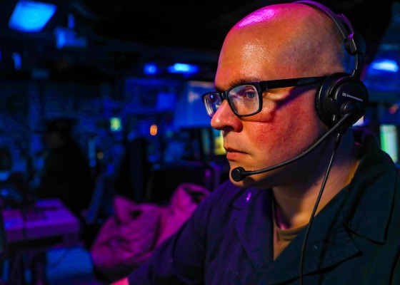 SOUTH CHINA SEA (Nov. 29, 2022) Fire Controlman (Aegis) 2nd Class Jonathon Kowalewski, from Kenosha, Wisconsin, conducts watch standing procedures in the combat information center as the Ticonderoga-class guided-missile cruiser USS Chancellorsville (CG 62) conducts routine operations in the South China Sea, Nov. 29. Chancellorsville is forward-deployed to the U.S. 7th Fleet area of operations in support of a free and open Indo-Pacific. (U.S. Navy photo by Mass Communication Specialist 2nd Class Justin Stack)