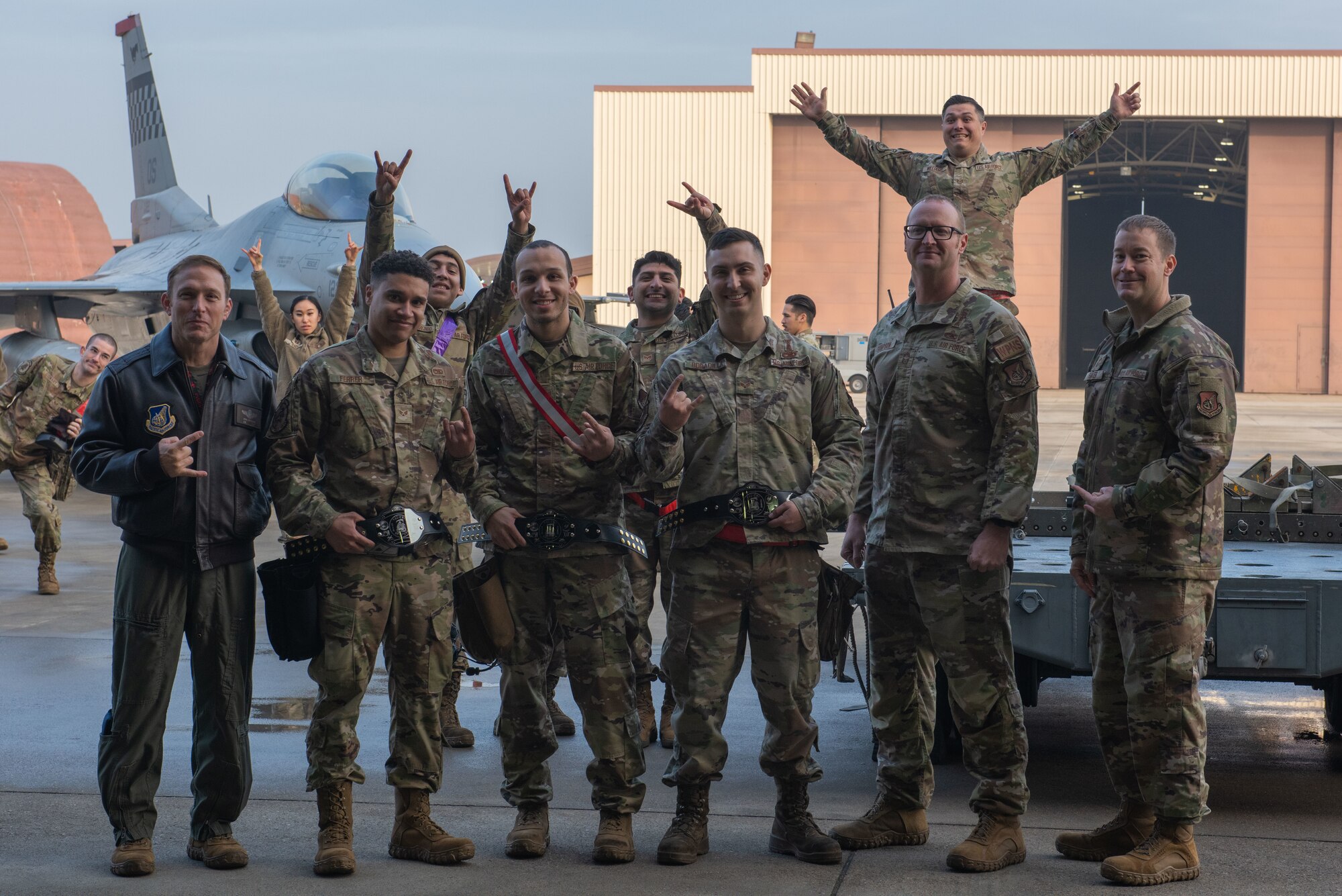 U.S. Air Force Col. Paul Davidson, 51st Fighter Wing vice commander, poses with USAF Staff Sgt. Anthony Gause and USAF Senior Airmen Jac Bobadilla and Angel Ferrer, winners of the third quarter Load Crew of the Quarter competition