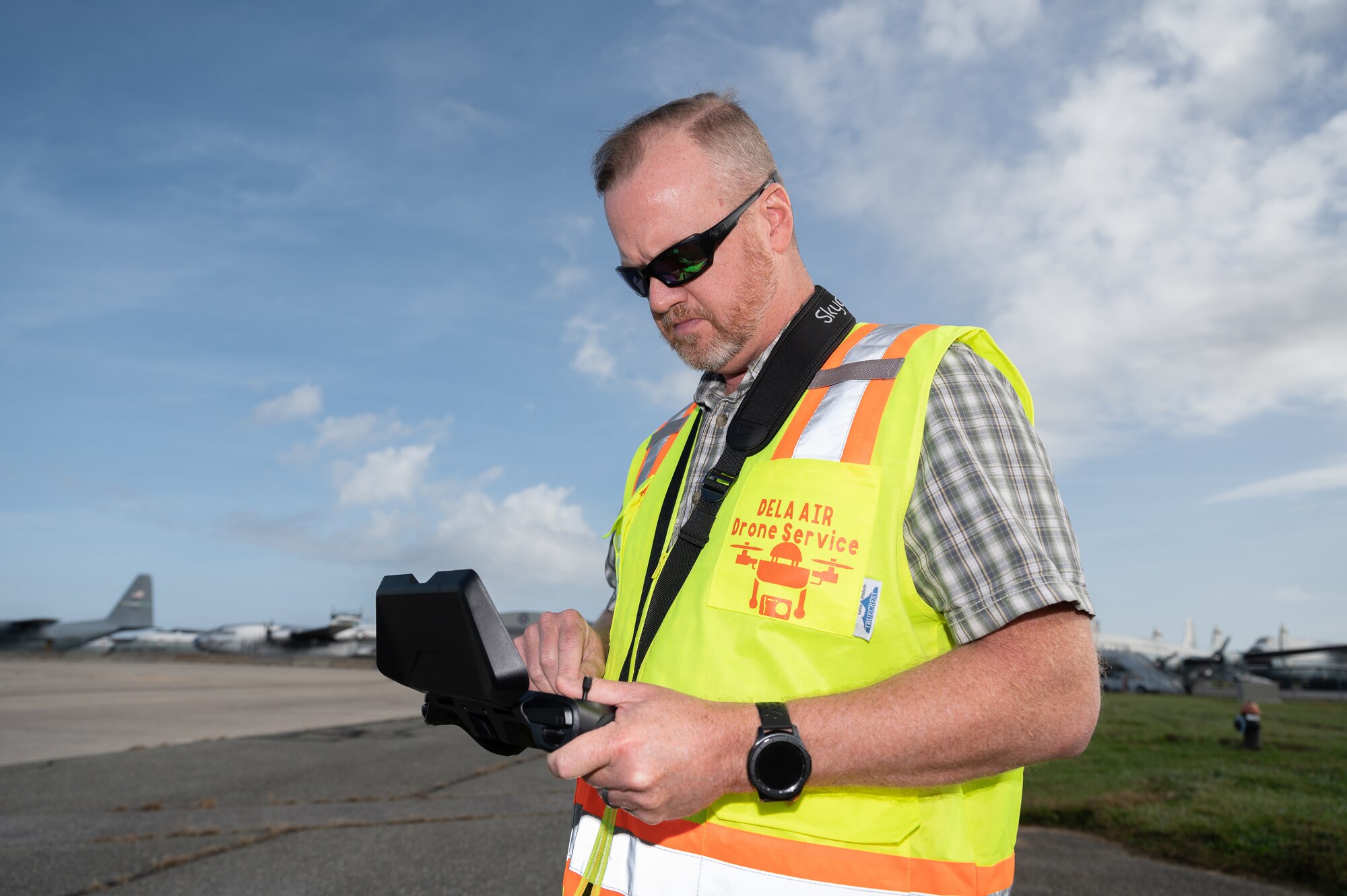 Ken Jones, 436th Mission Generation Group continuous process improvement manager, prepares a Skydio X2D drone for takeoff, at Dover Air Force Base, Delaware, Nov. 4, 2022. This flight marked the first drone inspection of the structural integrity of a Dover AFB aircraft. (U.S. Air Force photo by Mauricio Campino)