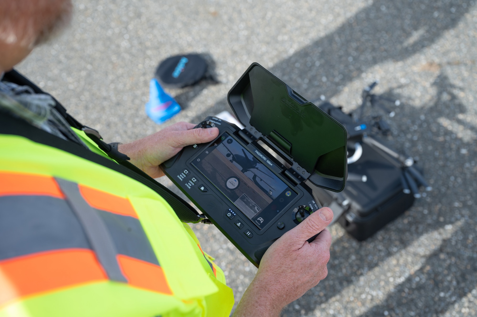 Ken Jones, 436th Mission Generation Group continuous process improvement manager, observes the camera angle from a Skydio X2D drone at Dover Air Force Base, Delaware, Nov. 4, 2022. This flight marked the first drone inspection of the structural integrity of a Dover AFB aircraft. (U.S. Air Force photo by Mauricio Campino)