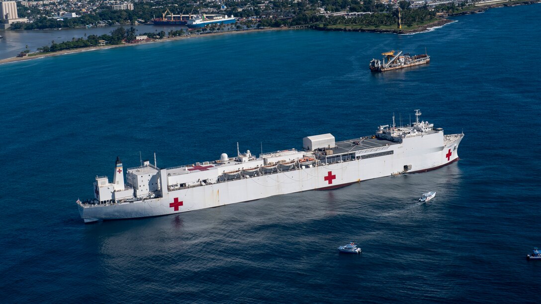 221127-N-DF135-1024 SANTO DOMINGO, Dominican Republic (Nov. 27, 2022) – The hospital ship USNS Comfort (T-AH 20) sits anchored in the harbor of Santo Domingo, Dominican Republic on Nov. 27, 2022. Comfort is deployed to U.S. 4th Fleet in support of Continuing Promise 2022, a humanitarian assistance and goodwill mission conducting direct medical care, expeditionary veterinary care, and subject matter expert exchanges with five partner nations in the Caribbean, Central and South America. (U.S. Navy photo by Mass Communication Specialist 3rd Class Deven Fernandez)