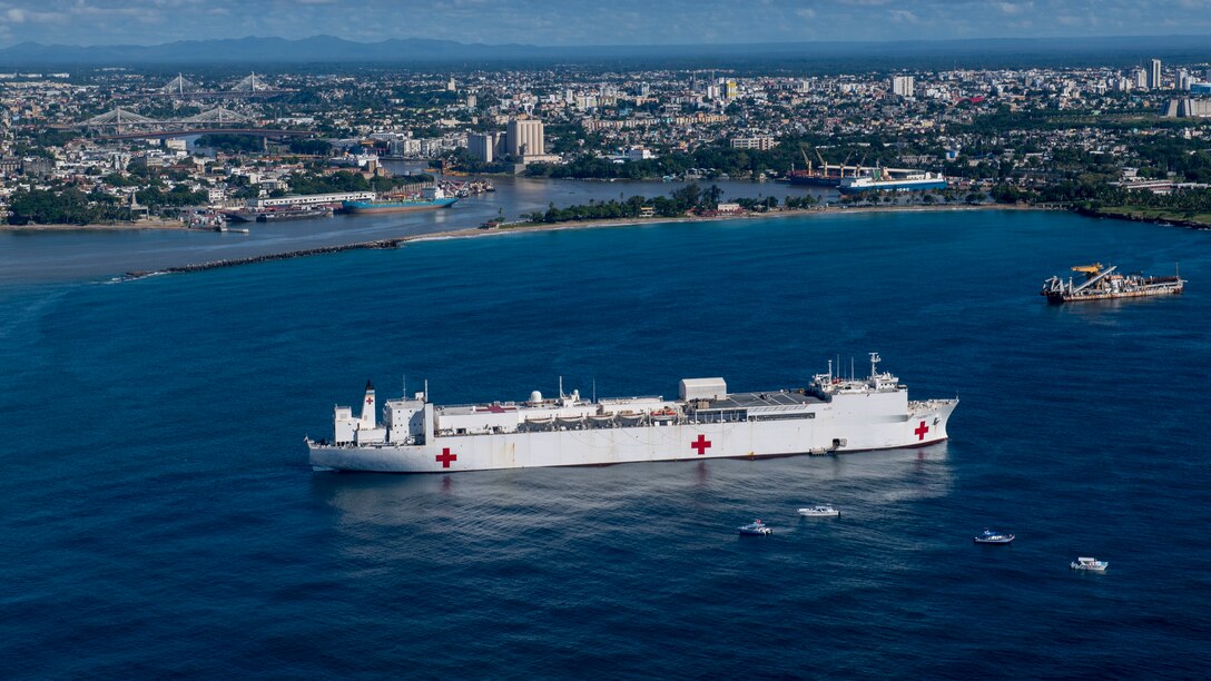 221127-N-DF135-1022 SANTO DOMINGO, Dominican Republic (Nov. 27, 2022) – The hospital ship USNS Comfort (T-AH 20) sits anchored in the harbor of Santo Domingo, Dominican Republic on Nov. 27, 2022. Comfort is deployed to U.S. 4th Fleet in support of Continuing Promise 2022, a humanitarian assistance and goodwill mission conducting direct medical care, expeditionary veterinary care, and subject matter expert exchanges with five partner nations in the Caribbean, Central and South America. (U.S. Navy photo by Mass Communication Specialist 3rd Class Deven Fernandez)