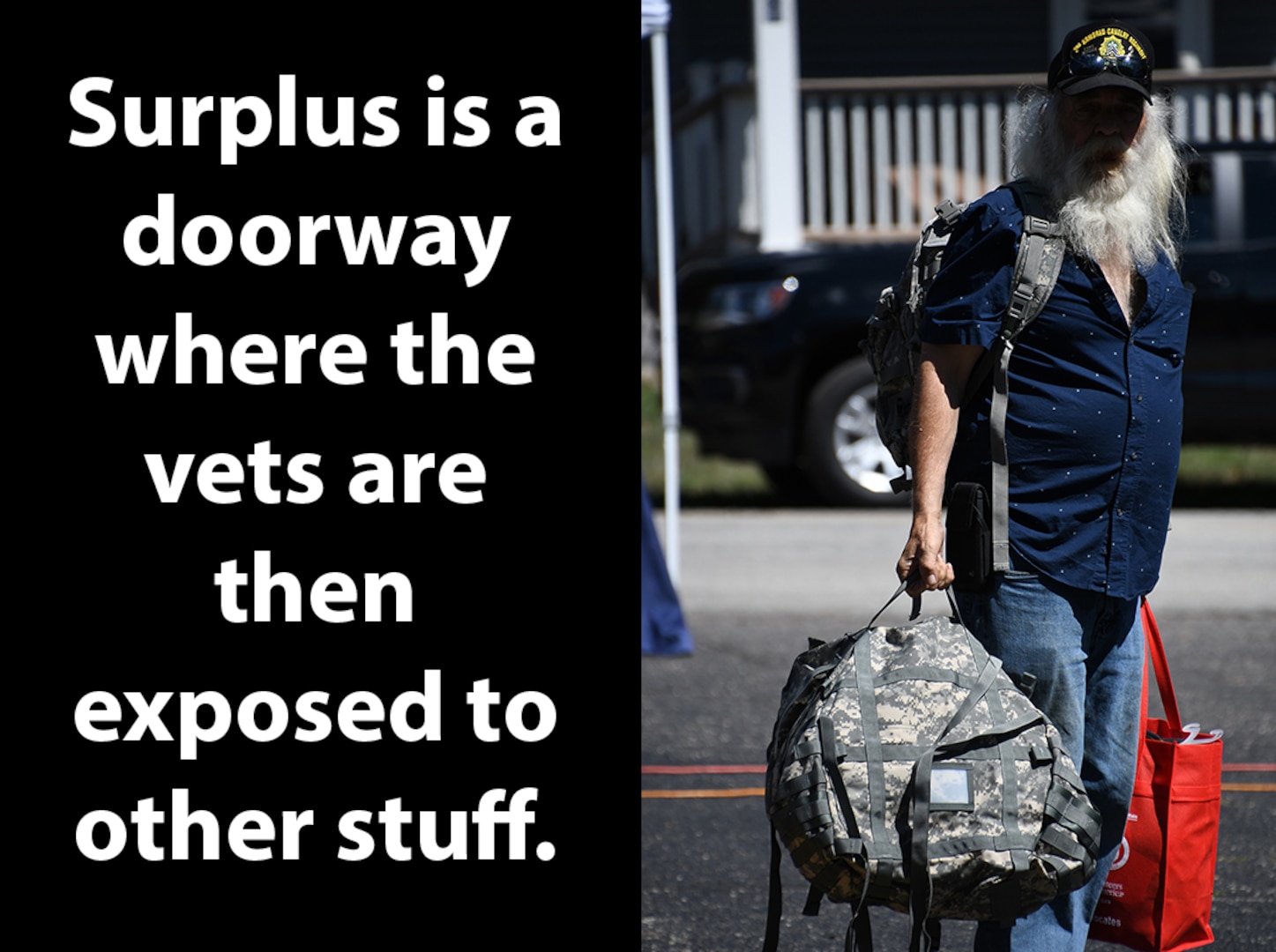 A man holds military surplus bags.