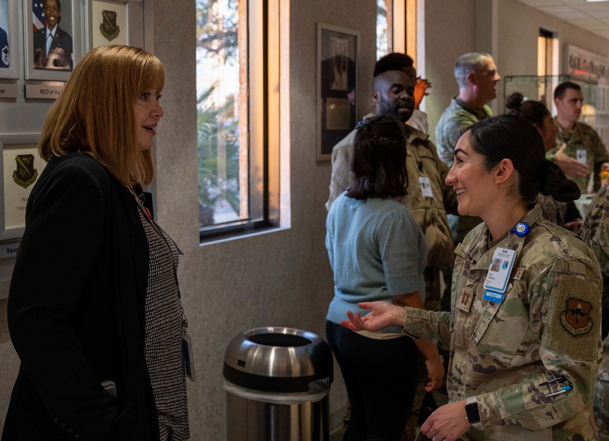 Airmen from Laughlin Air Force Base, Texas, talk with medical service providers from the local community at the Humana Military Open House on Nov. 16, 2022, at Laughlin. The open house gives an opportunity for military medical service providers and local medical service providers to build familiarity with each other and help each other understand the needs for readiness and medical care. (U.S. Air Force photo by Senior Airman Nicholas Larsen)