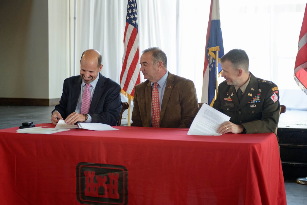 Col. Travis Rayfield, U.S. Army Corps of Engineers, Kansas City District commander (right), and Dru Buntin, Missouri Department of Natural Resources director (left), partnered to sign a Feasibility Cost Share Agreement for a feasibility study on the area around river mile 142 with Lt. Gov. Mike Kehoe (middle) as their witness, on Nov. 28, 2022, in Jefferson City Missouri. | Photo by Andrew Richmond, Missouri Department of Natural Resources