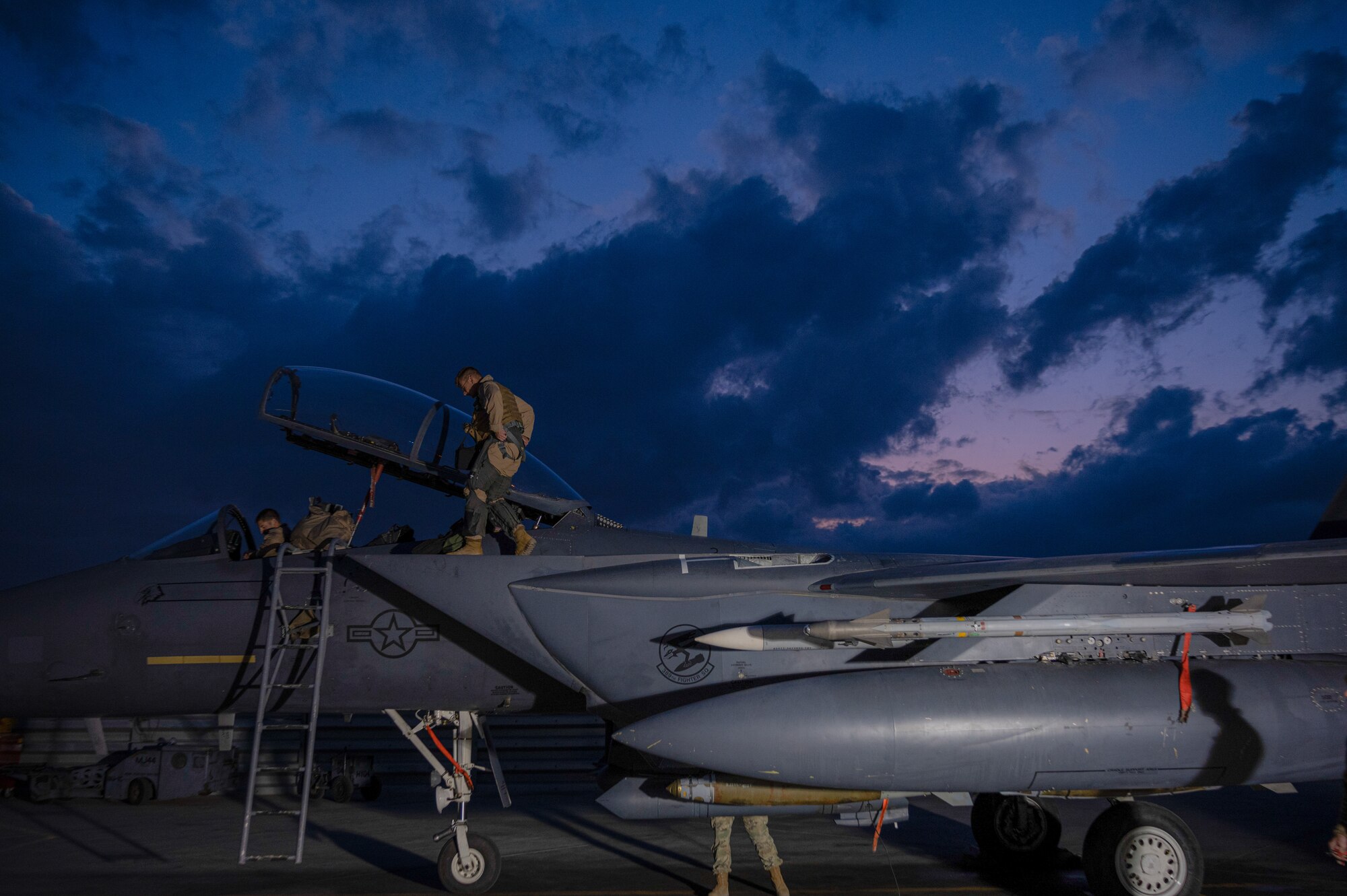 Airmen from the 389th Expeditionary Fighter Squadron prepare an F-15E Strike Eagle fighter jet for takeoff during the “Maintainer for a Day” program at an undisclosed location, Nov. 10, 2022. Maintainer for a Day is an initiative that pairs Airmen across a variety of career fields with members of aircraft maintenance shops for a hands-on learning experience with F-15E Strike Eagle fighter jets. (U.S. Air Force photo by Tech. Sgt. Richard Mekkri)