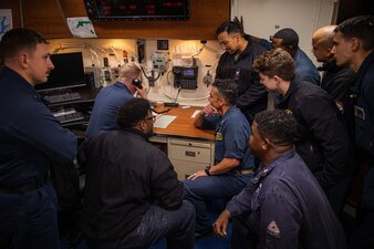 Sailors speak with President Joe Biden during a Thanksgiving Day phone call aboard USS Paul Ignatius (DDG 117) in the English Channel.