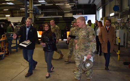 Walking through one of the maintenance facilities at the Eygelshoven Army Prepositioned Stocks-2 worksite, Gregory Hahn, the Eygleshoven APS-2 site director, briefs U.S. Ambassador to the Netherlands Shefali Razdan Duggal, Nov. 28. “The ambassador’s key focus during her visit was on interpersonal relationships between the U.S. government and our host nation Dutch Ministry of Defense workforce and how we work together to accomplish the mission,” said Maj. James Maskovyak, AFSBn-Benelux executive officer and Support Operations officer. “She seemed very impressed.” (Photo by Charéll de Koster, USAG Benelux public affairs)