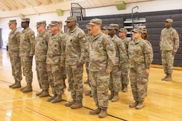 Soldiers stand at attention in formation