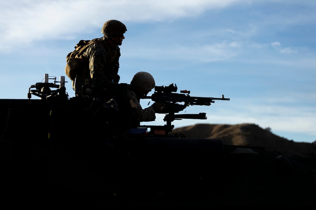 A U.S. Marine with 1st Radio Battalion, I Marine Expeditionary Force Information Group, fires an M240B machine gun mounted to a light armored electronic warfare vehicle during a tactical small unit leaders course at Marine Corps Base Camp Pendleton, California, Nov. 4, 2022. 1st Radio Battalion participated in TSULC to give small unit leaders the confidence, knowledge and ability to better lead their Marines in combat situations.