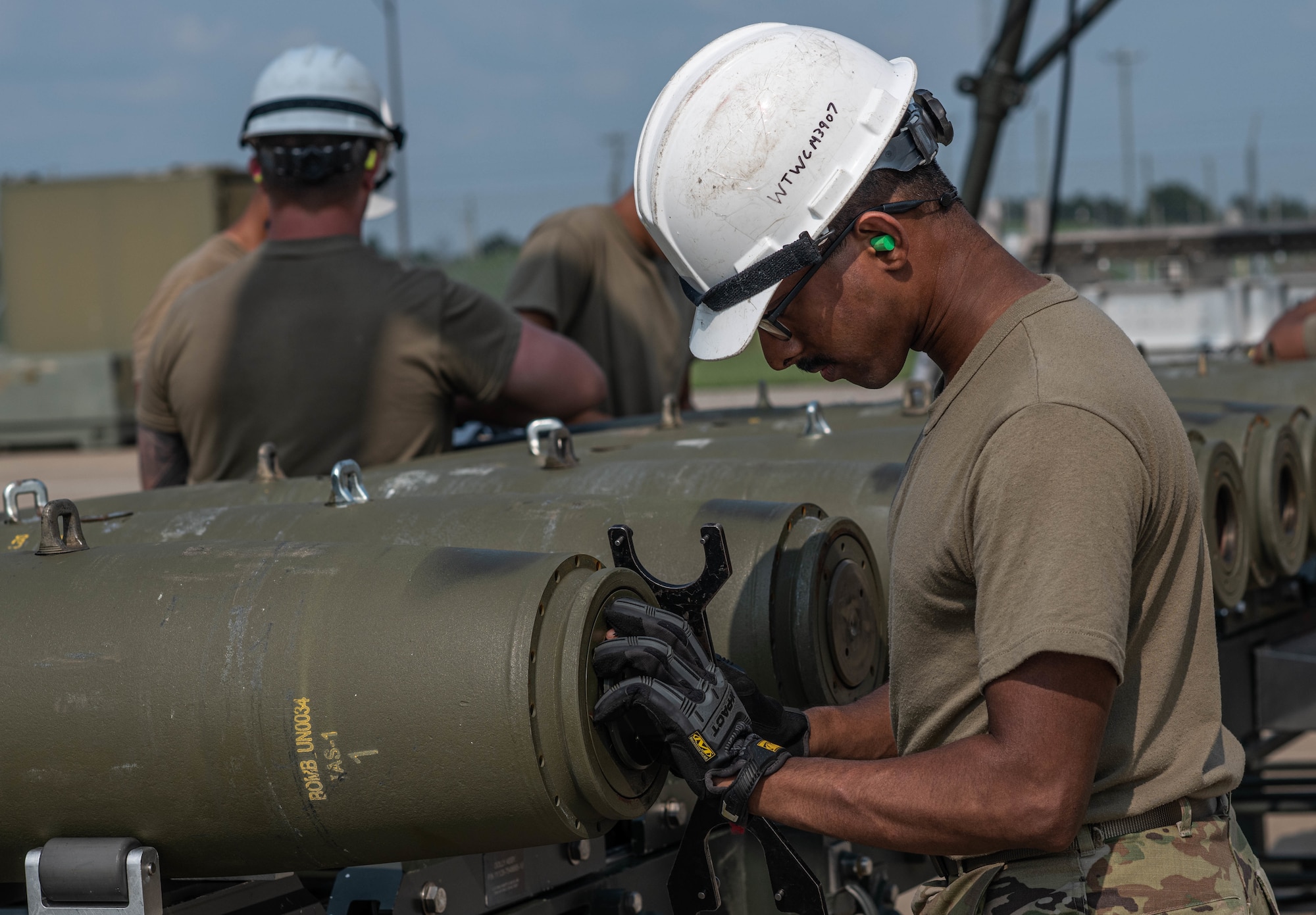 U.S. Air Force Airman 1st Class, Sooraj Thaivalappil, 509th Munitions Squadron conventional maintenance crew chief, prepares the tail end of a Guided Bomb Unit (GBU-38) assembly during exercise Quick Fuze at Whiteman Air Force Base, Missouri, July 20, 2021. Exercise Quick Fuze evaluates the squadron's ability to rapidly produce munitions. Quick Fuze is a routine exercise used to prepare contingency weapons for the B-2 Spirit and maintain operational readiness to effectively support the stealth bomber. (U.S. Air Force photo by Airman 1st Class Victoria Hommel)